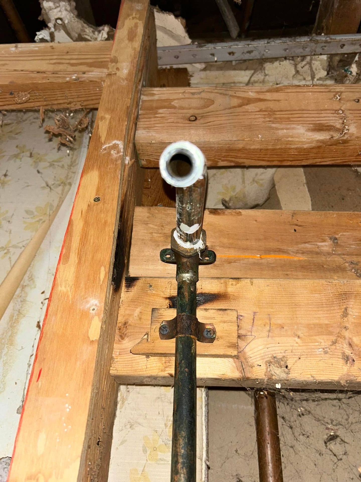 New copper supply line soldered and strapped to framing during a repipe