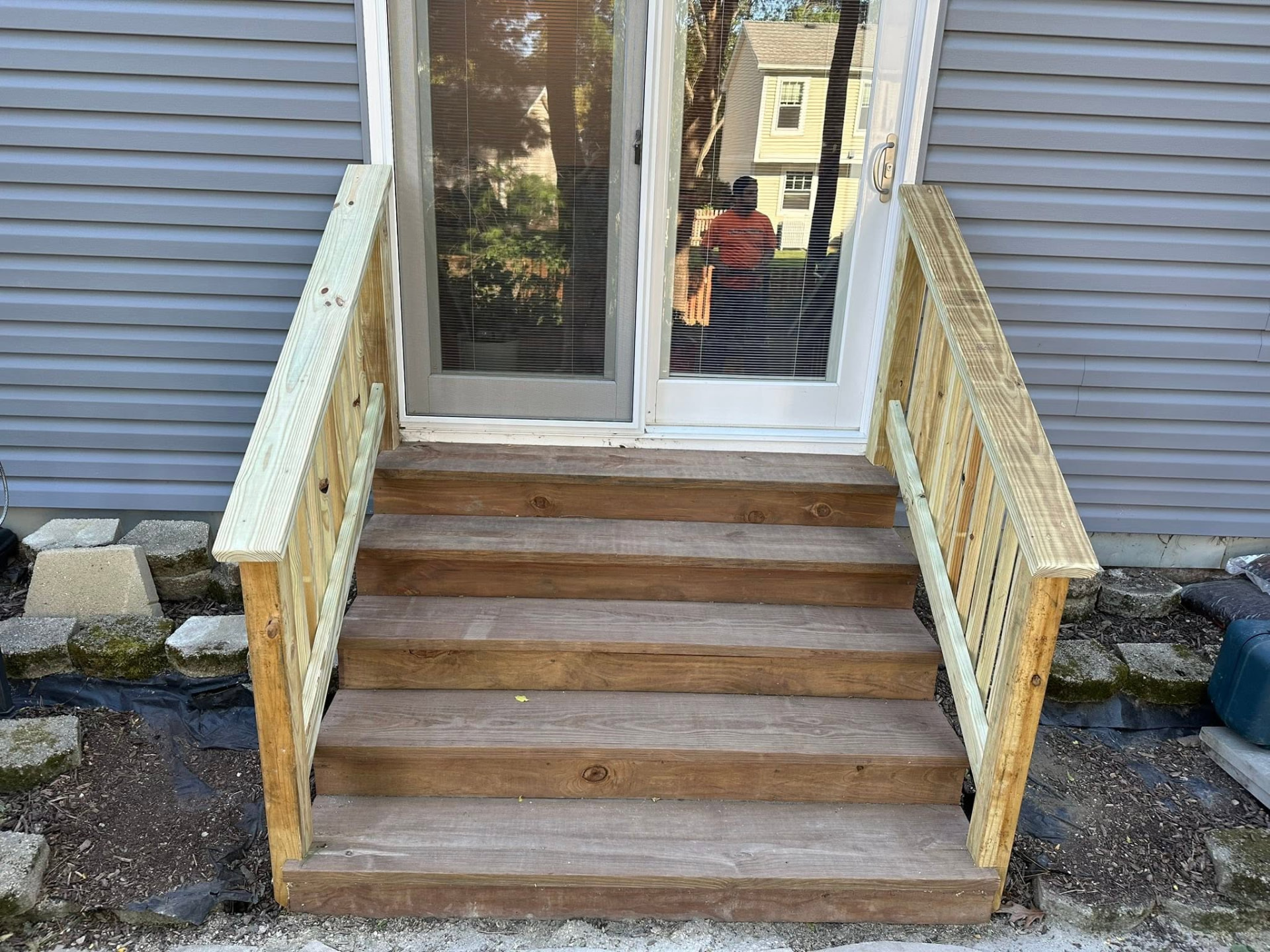 Finished exterior wood steps with double handrails
