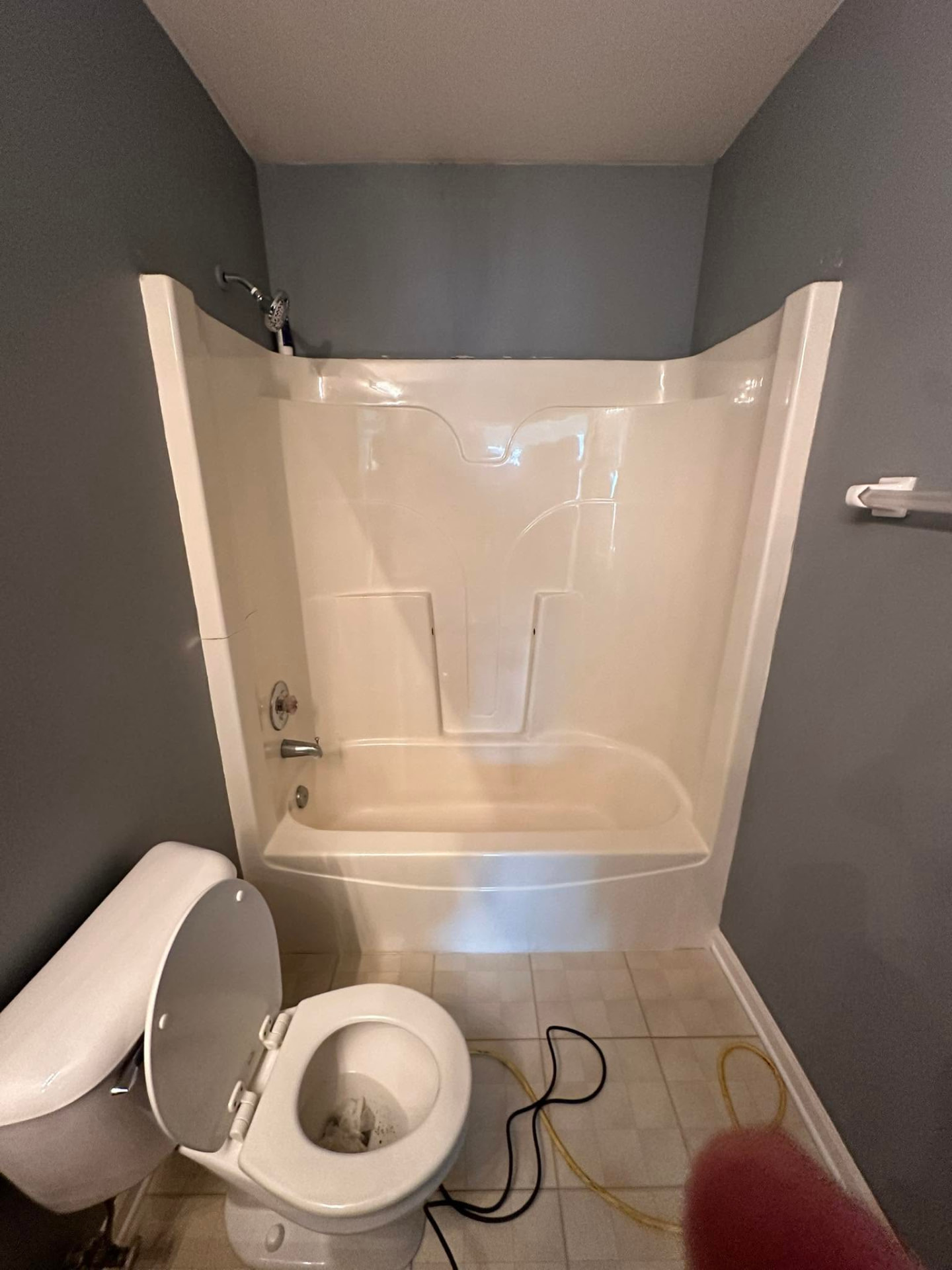 Bathroom with new tub and wall surround installed