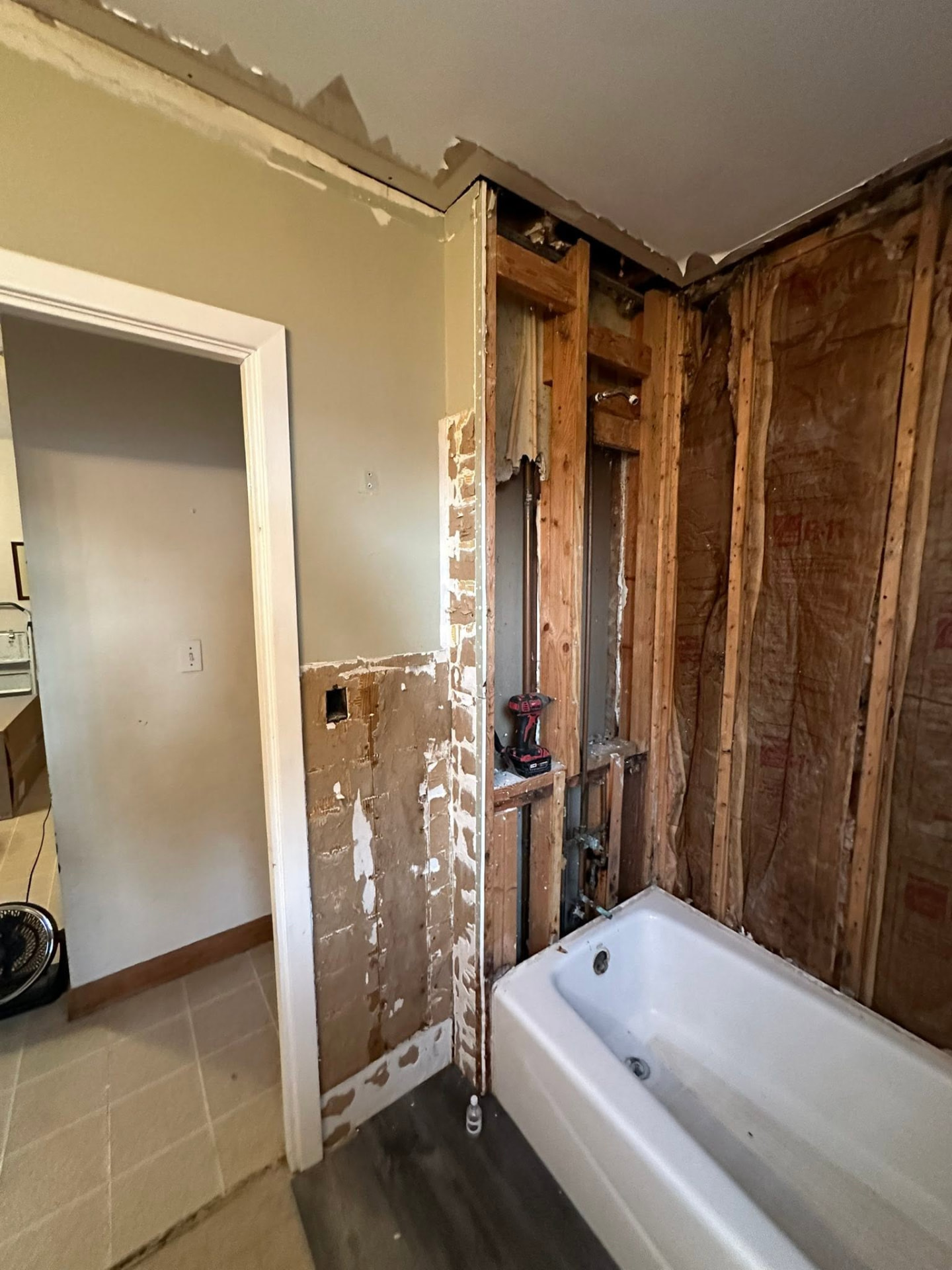 Bathroom wall opened to the studs during a tub and shower rebuild
