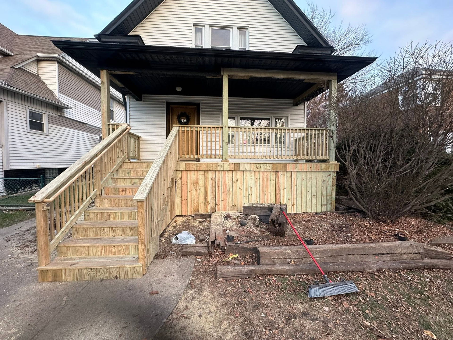 Rebuilt covered front porch with new stairs, railings and skirting