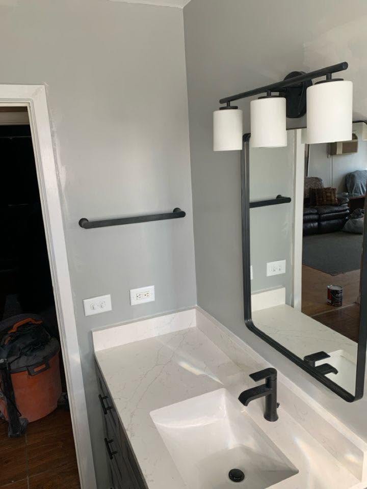 New quartz vanity with matte black faucet and mirror