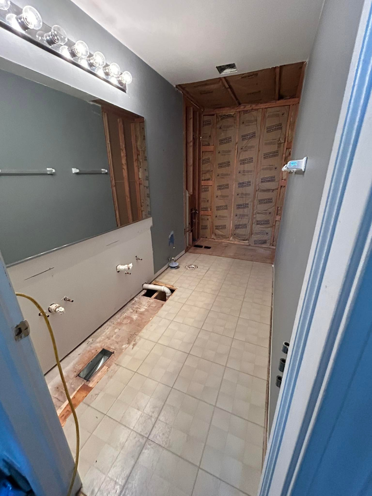 Bathroom walls opened to framing during a full remodel