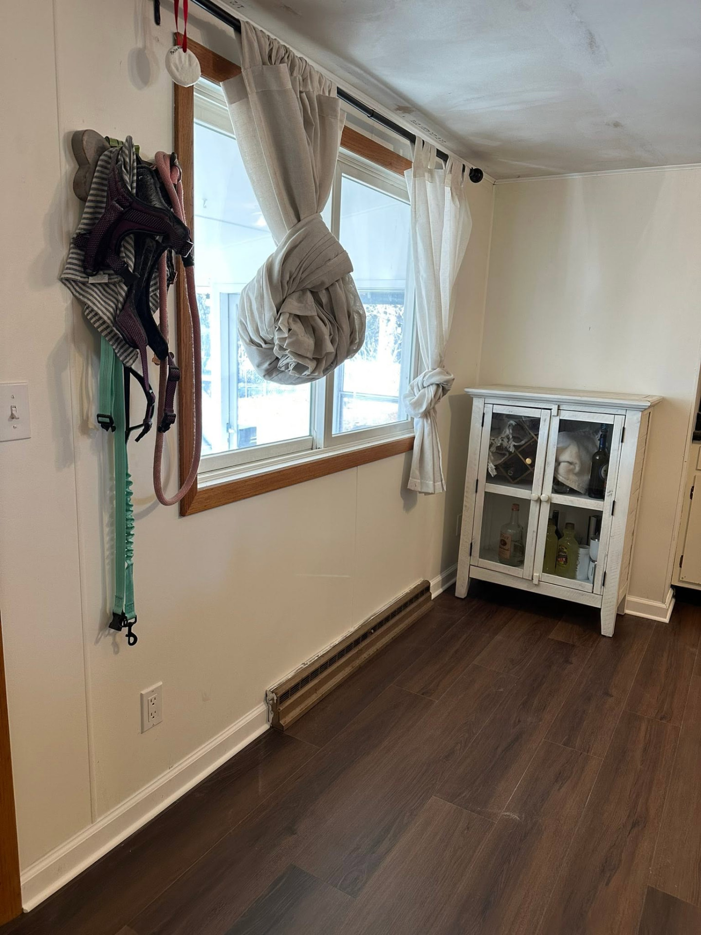Room with new luxury vinyl plank flooring and trim