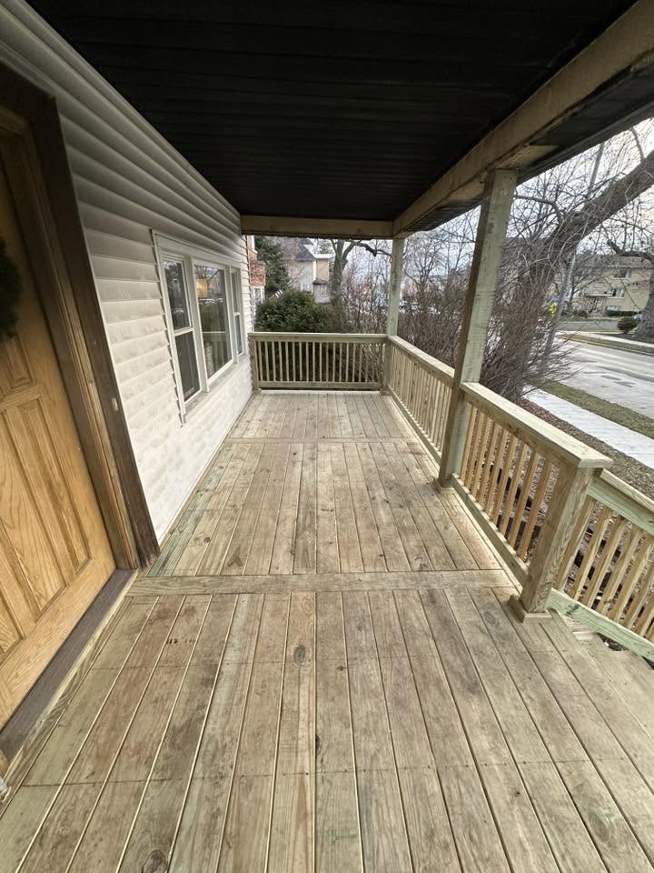 Rebuilt wraparound front porch with new decking and spindle railing